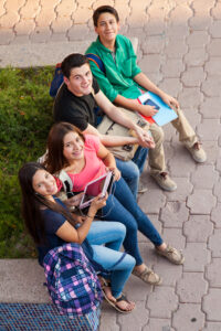 high angle view group high school friends hanging out after class